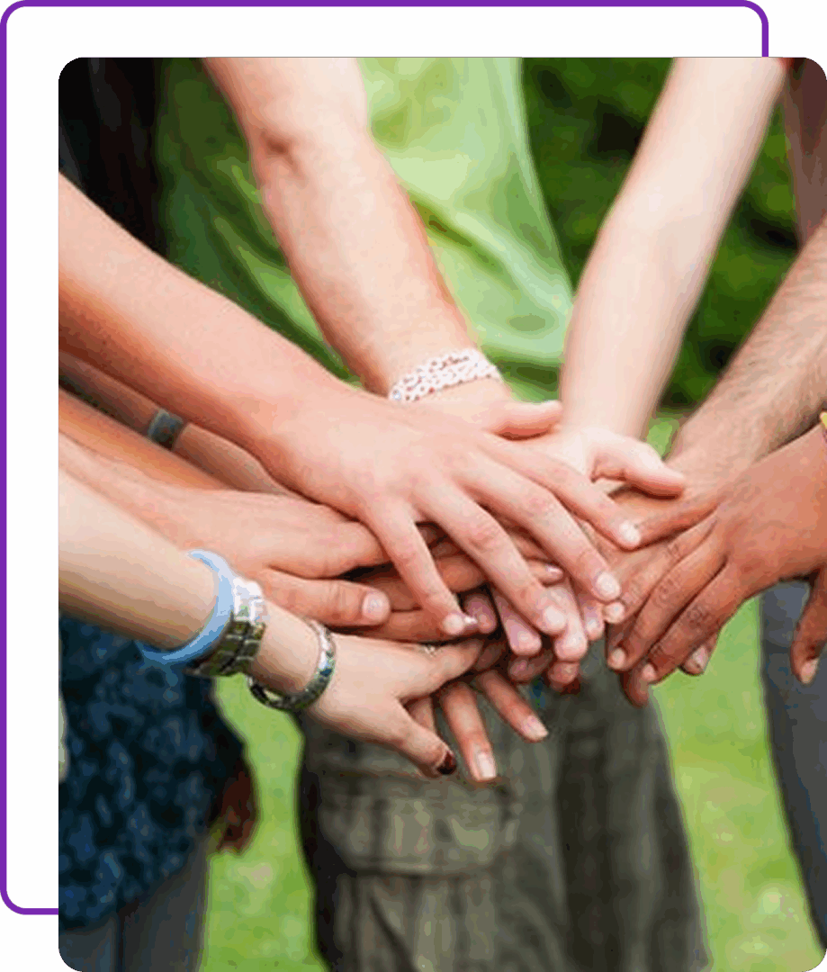 Hands joined together in group unity.